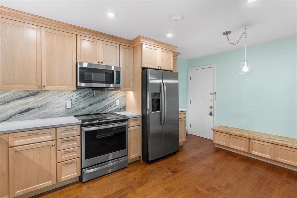Interior, Kitchen, Marble Walls, Pendant Lights, Recessed Lighting, Stainless Steel Appliances, Wood Texture Flooring