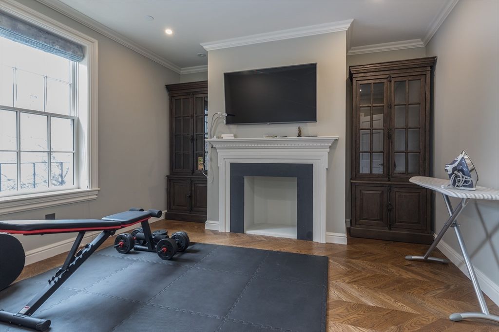 Fireplace, Fitness Equipment, Interior, Recessed Lighting, Wood Texture Flooring