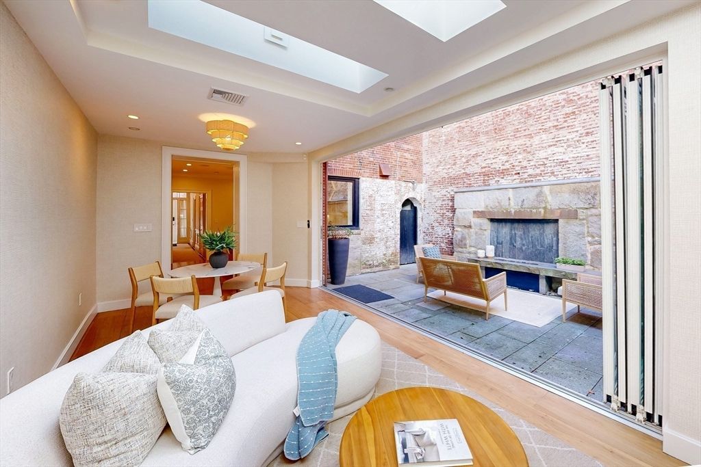 Chandelier, Dining room, Fireplace, Interior, Living room, Recessed Lighting, Stone Walls, Wood Texture Flooring