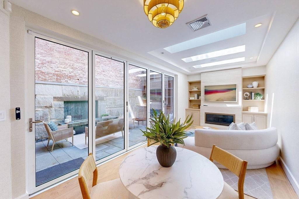 Dining room, Fireplace, Interior, Living room, Recessed Lighting, Wood Texture Flooring