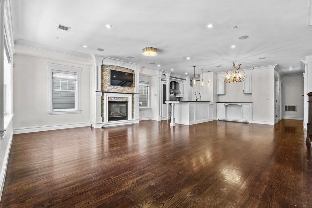 Empty room, Fireplace, Interior, Kitchen, Pendant Lights, Recessed Lighting, Wood Texture Flooring