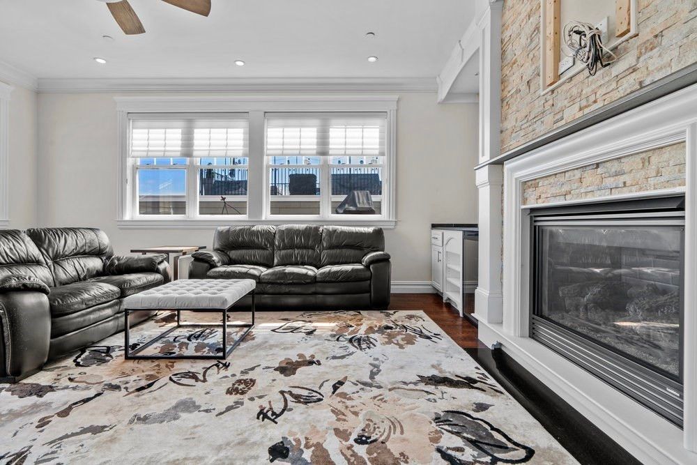 Fireplace, Interior, Living room, Recessed Lighting, Stone Walls, Water, Wood Texture Flooring