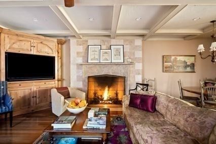 Chandelier, Dining room, Fireplace, Interior, Living room, Recessed Lighting, Stone Walls, Wood Texture Flooring