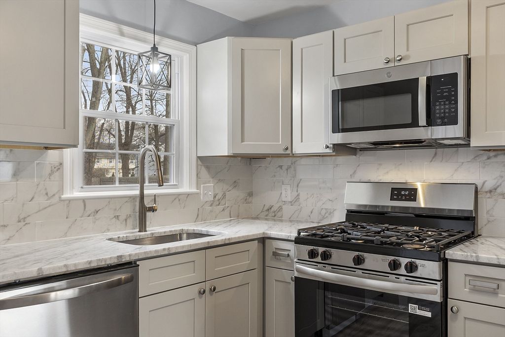 Interior, Kitchen, Marble Walls, Pendant Lights, Stainless Steel Appliances