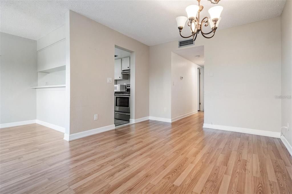 Chandelier, Empty room, Interior, Kitchen, Stainless Steel Appliances, Wood Texture Flooring