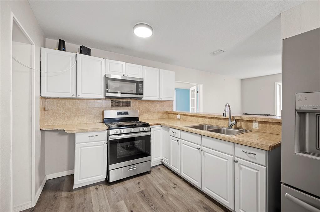 Interior, Kitchen, Tile Countertops, Wood Texture Flooring