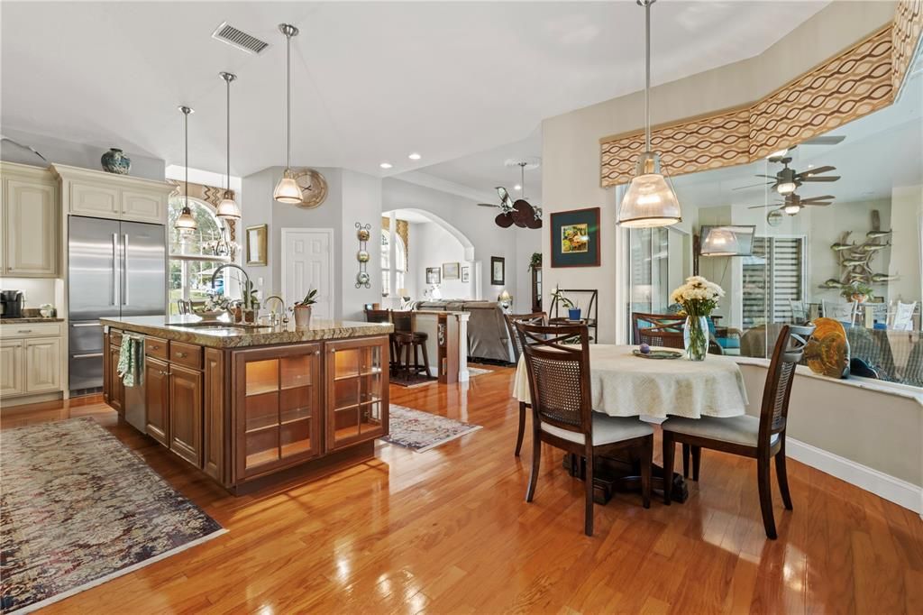 Dining room, Interior, Kitchen, Pendant Lights, Recessed Lighting, Stainless Steel Appliances, Wood Texture Flooring