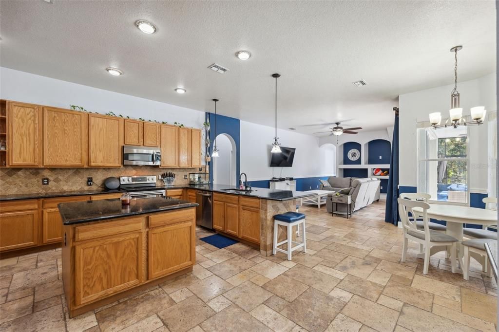 Chandelier, Dining room, Interior, Kitchen, Living room, Pendant Lights, Recessed Lighting, Stainless Steel Appliances