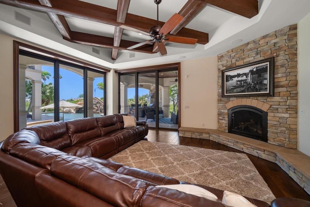 Fireplace, Interior, Living room, Recessed Lighting, Stone Walls, Wooden Beams, Wood Texture Flooring
