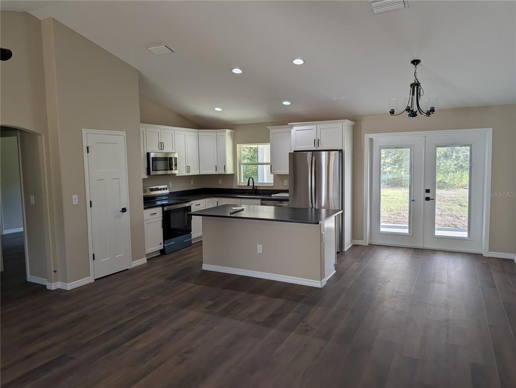 Chandelier, Interior, Kitchen, Recessed Lighting, Stainless Steel Appliances, Wood Texture Flooring