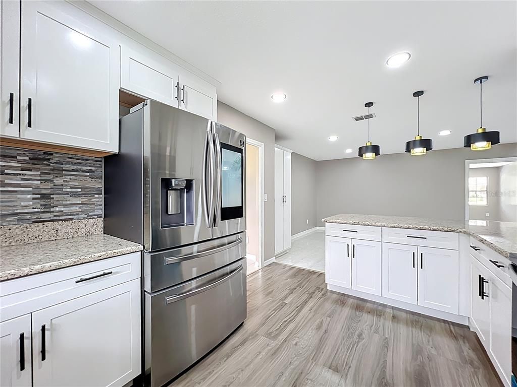 Interior, Kitchen, Pendant Lights, Recessed Lighting, Stainless Steel Appliances, Wood Texture Flooring