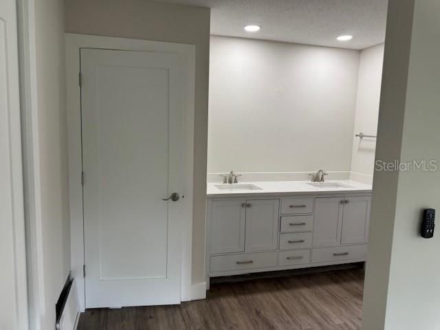 Bathroom, Dual Sink Vanities, Interior, Recessed Lighting, Wood Texture Flooring