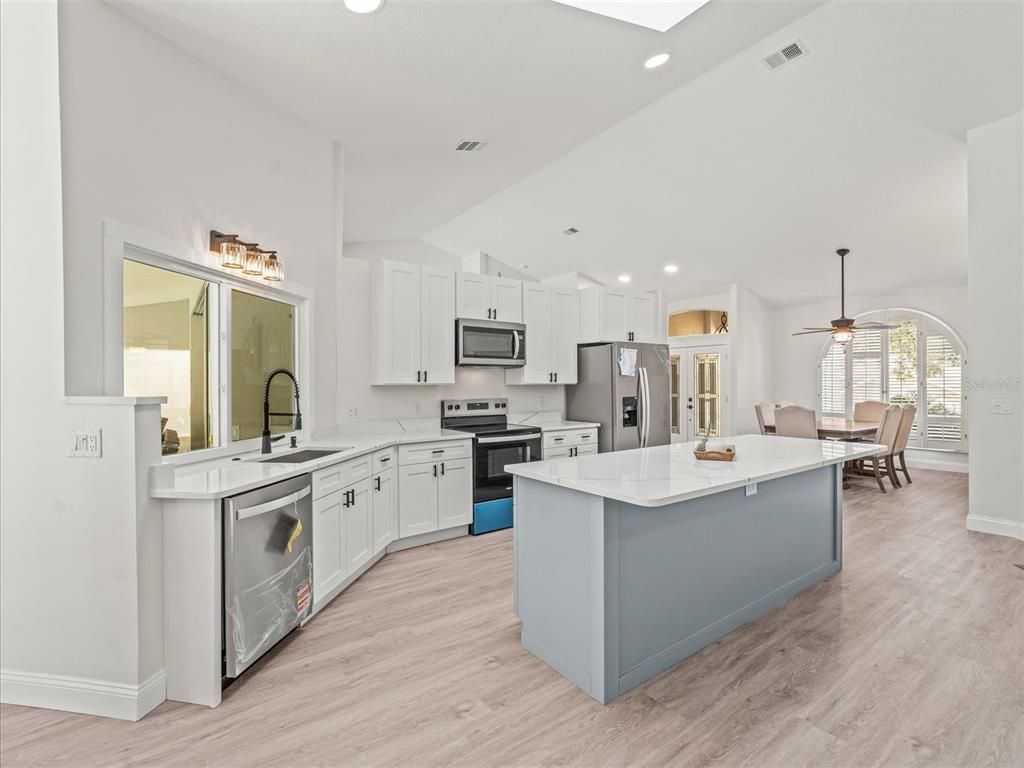 Dining room, Interior, Kitchen, Pendant Lights, Recessed Lighting, Stainless Steel Appliances, Wood Texture Flooring