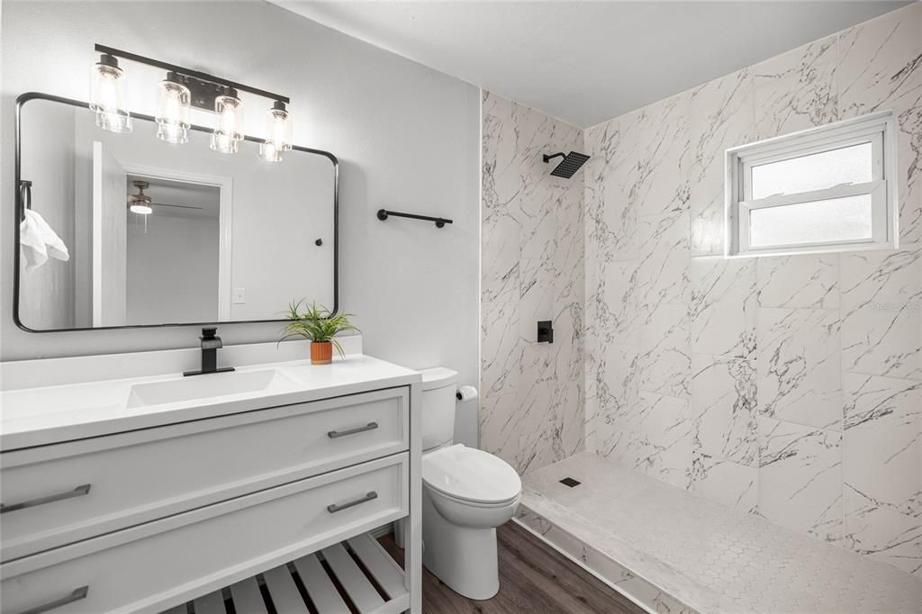Bathroom, Glass Shower, Interior, Marble Walls, Wood Texture Flooring
