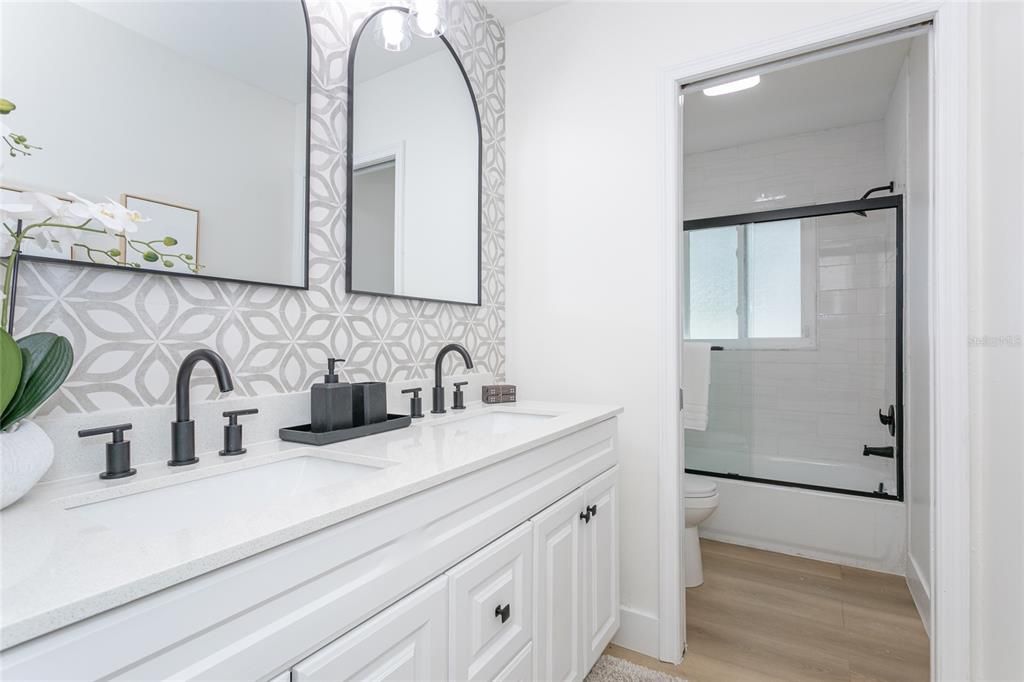 Bathroom, Dual Sink Vanities, Glass Shower, Interior, Recessed Lighting, Wood Texture Flooring