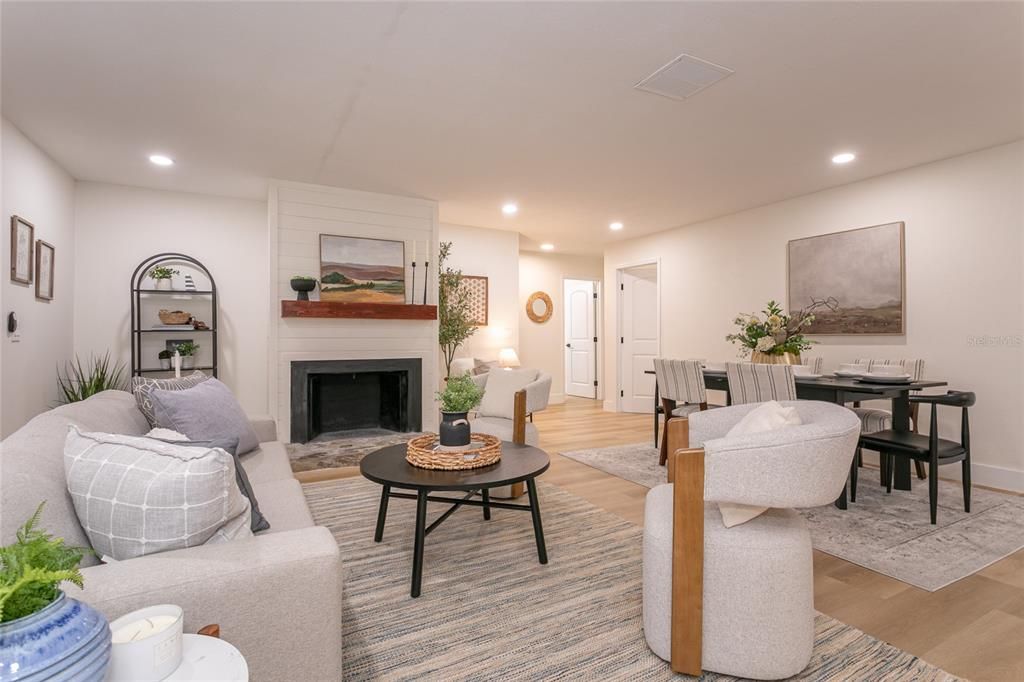 Dining room, Fireplace, Interior, Living room, Recessed Lighting, Wood Texture Flooring
