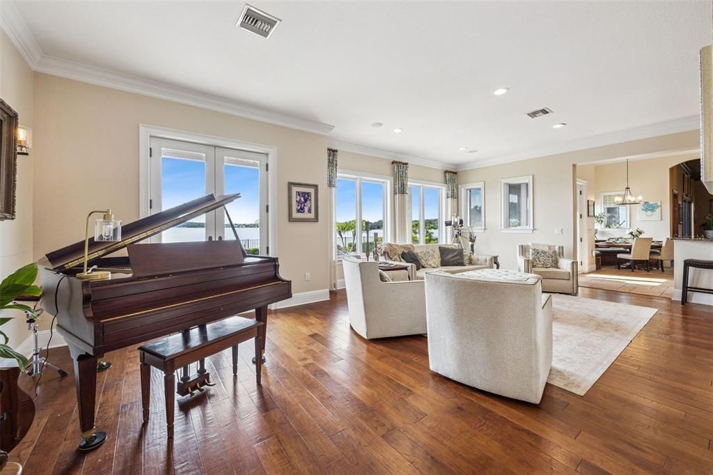 Dining room, Interior, Living room, Pendant Lights, Piano, Recessed Lighting, Wood Texture Flooring