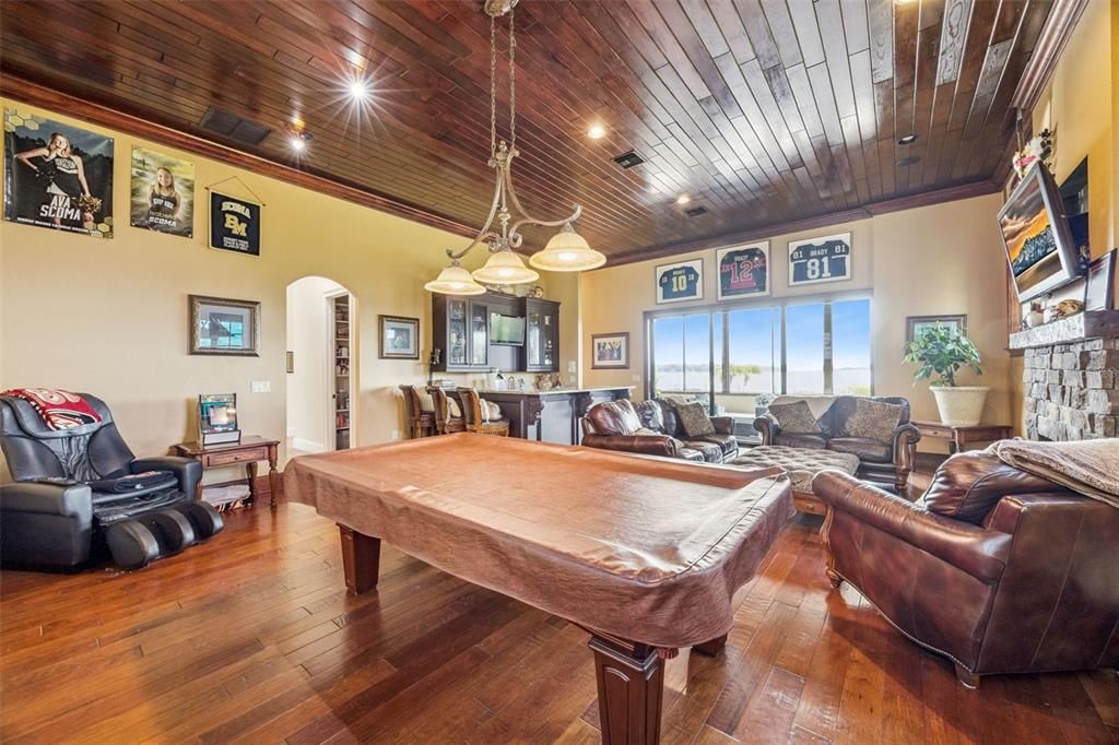 Billiard Table, Game Room, Interior, Living room, Pendant Lights, Recessed Lighting, Wooden Ceilings, Wood Texture Flooring