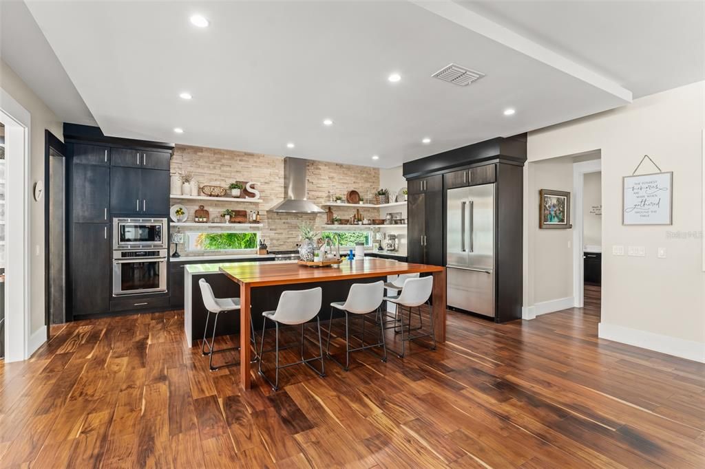 Dining room, Interior, Kitchen, Recessed Lighting, Stainless Steel Appliances, Stone Walls, Wood Texture Flooring