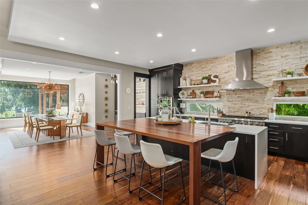 Dining room, Interior, Kitchen, Pendant Lights, Recessed Lighting, Stainless Steel Appliances, Stone Walls, Wood Texture Flooring