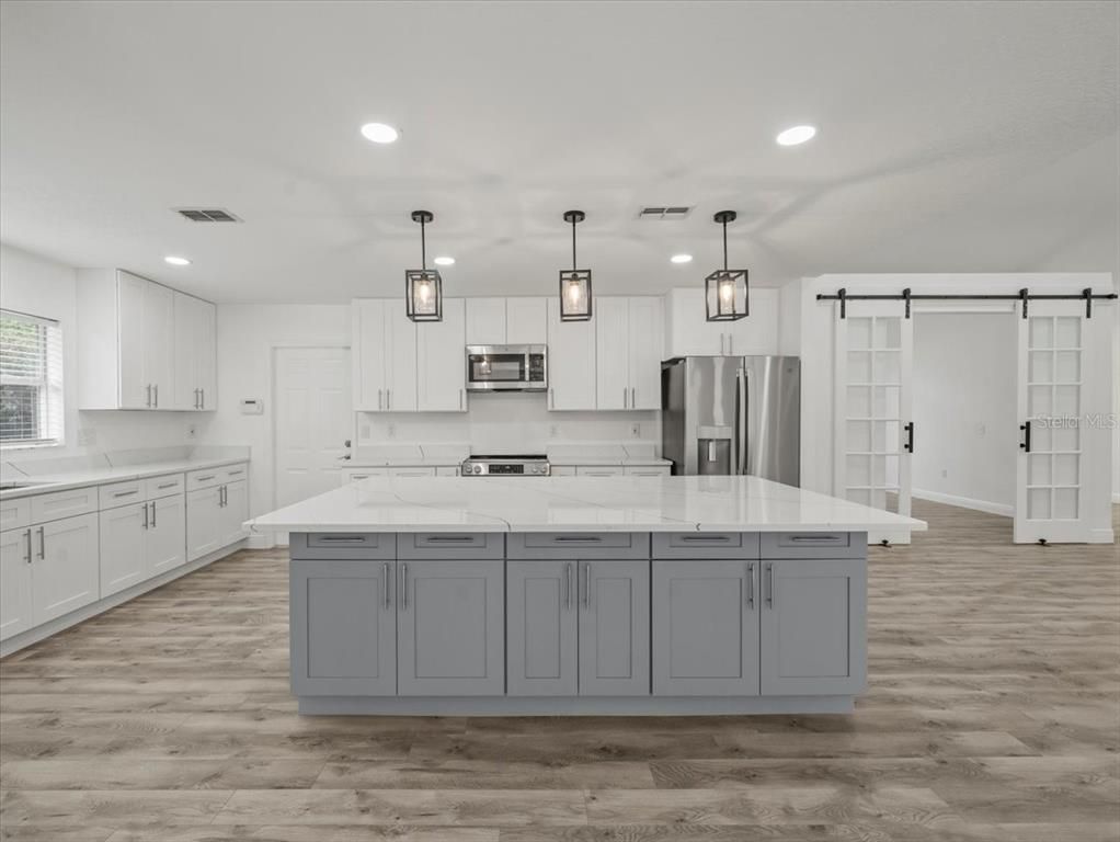 Interior, Kitchen, Pendant Lights, Recessed Lighting, Stainless Steel Appliances, Wood Texture Flooring