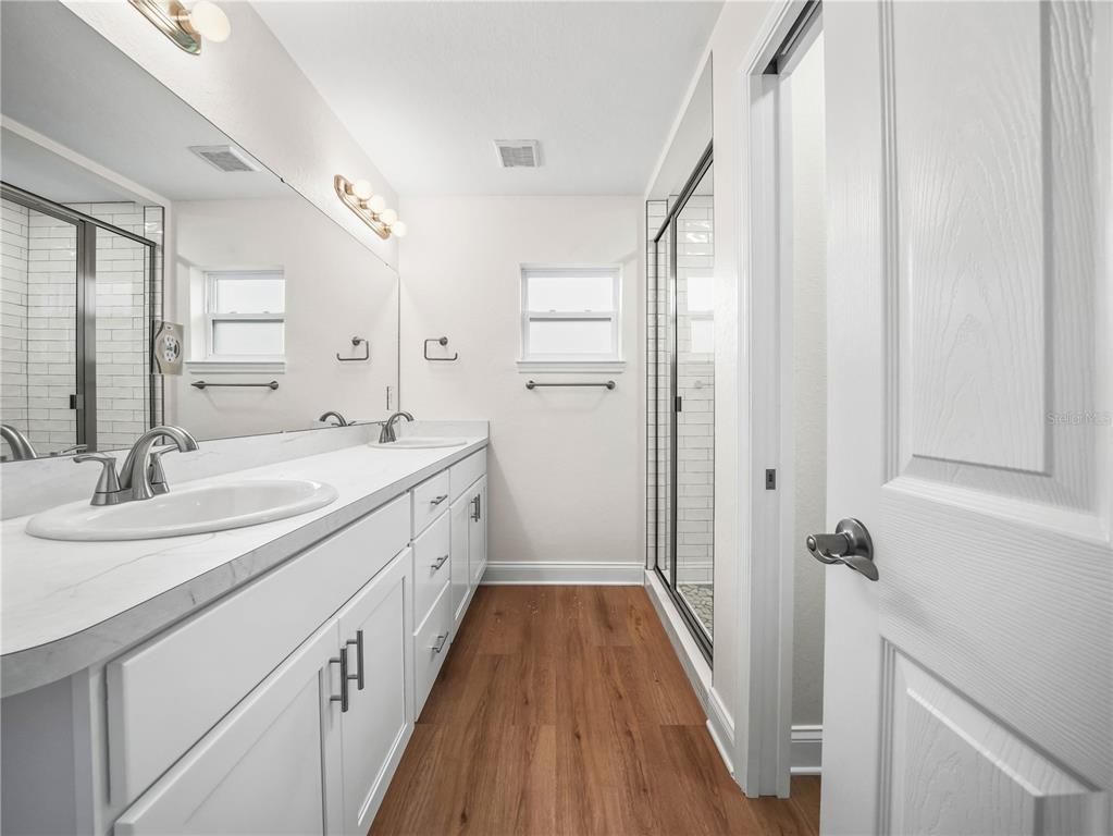 Bathroom, Dual Sink Vanities, Glass Shower, Interior, Wood Texture Flooring