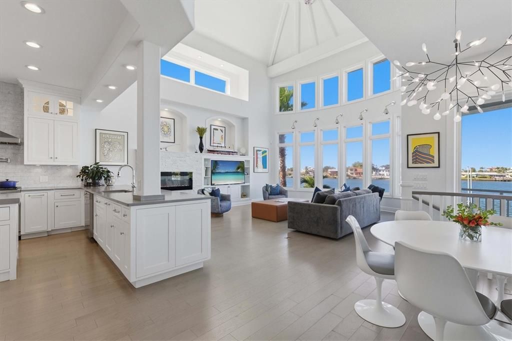 Dining room, Fireplace, Interior, Kitchen, Living room, Pendant Lights, Recessed Lighting, Water, Wood Texture Flooring