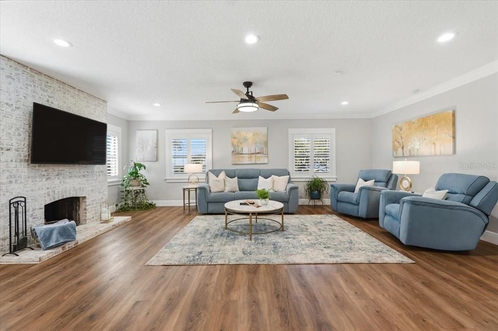 Fireplace, Interior, Living room, Recessed Lighting, Stone Walls, Wood Texture Flooring