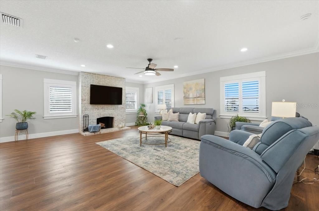 Fireplace, Interior, Living room, Recessed Lighting, Stone Walls, Wood Texture Flooring