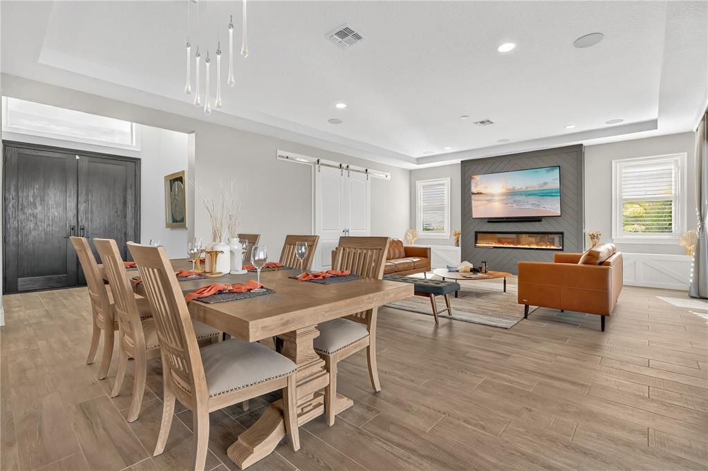 Dining room, Fireplace, Interior, Living room, Pendant Lights, Recessed Lighting, Wood Texture Flooring