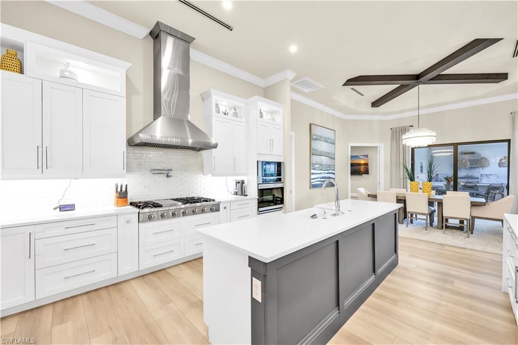 Dining room, Interior, Kitchen, Pendant Lights, Recessed Lighting, Stainless Steel Appliances, Water, Wooden Beams, Wood Texture Flooring