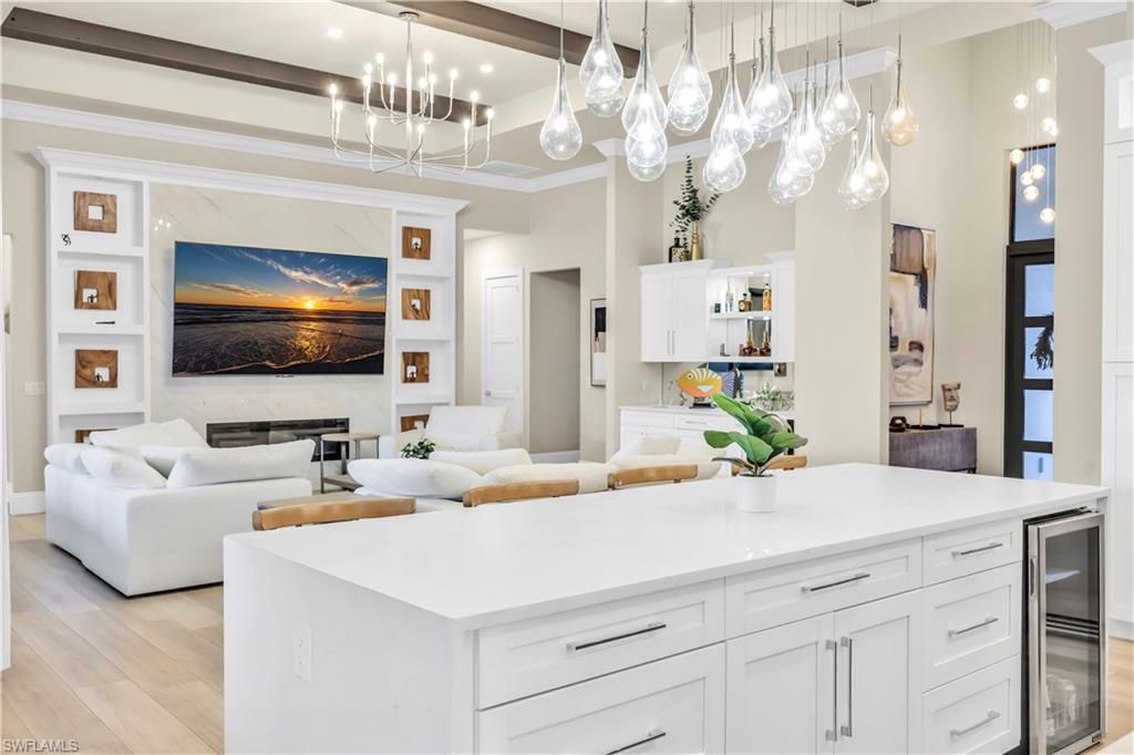 Fireplace, Interior, Kitchen, Living room, Pendant Lights, Recessed Lighting, Stainless Steel Appliances, Wood Texture Flooring