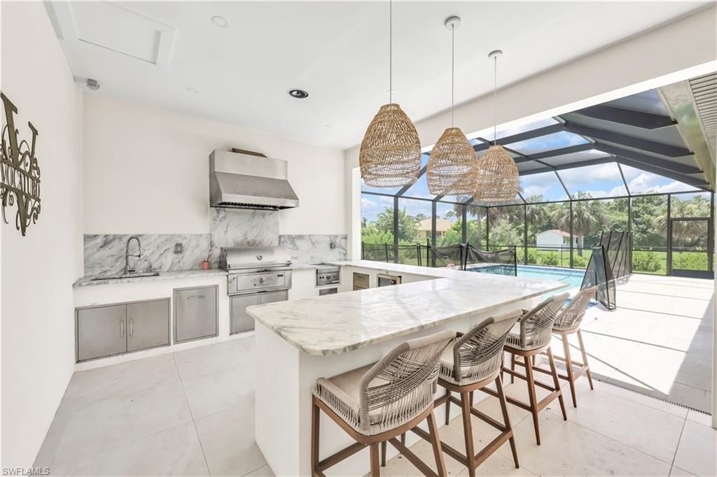 Glass Ceilings, Interior, Kitchen, Marble Walls, Pendant Lights, Pool, Recessed Lighting, Stainless Steel Appliances, Sun Room