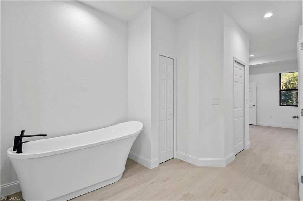 Bathroom, Free Standing Baths, Interior, Recessed Lighting, Wood Texture Flooring