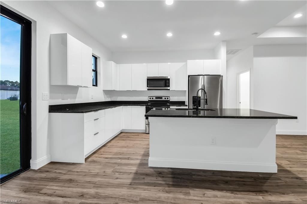 Interior, Kitchen, Recessed Lighting, Stainless Steel Appliances, Wood Texture Flooring