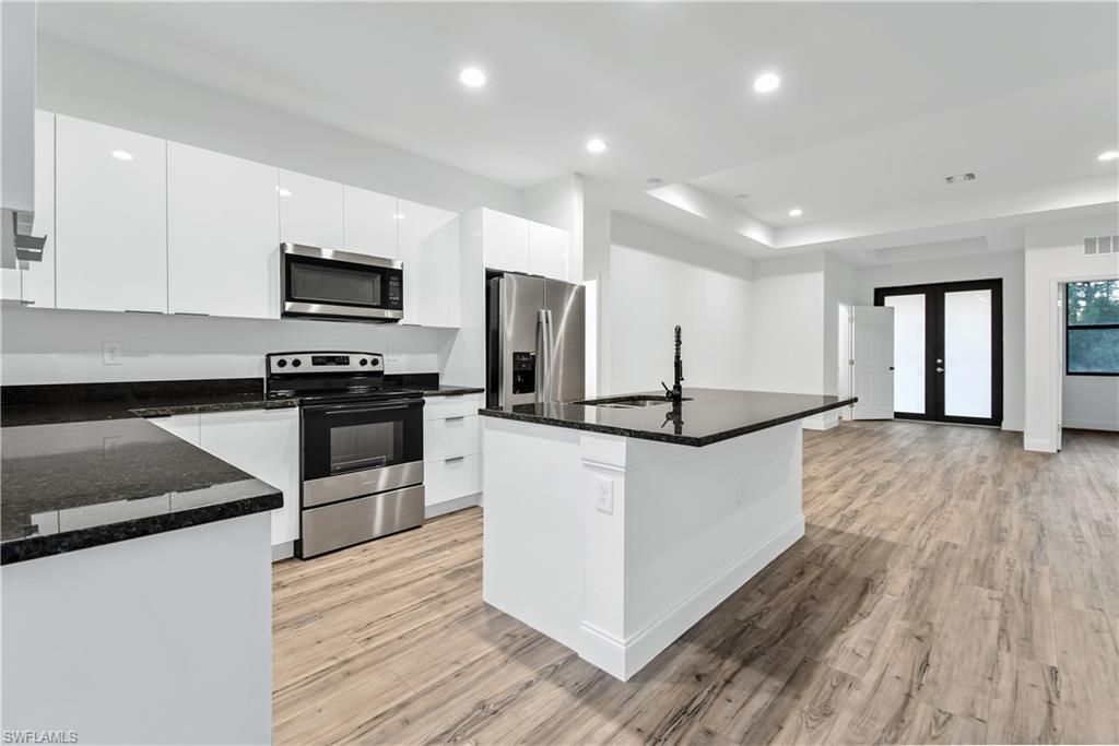 Interior, Kitchen, Recessed Lighting, Stainless Steel Appliances, Wood Texture Flooring