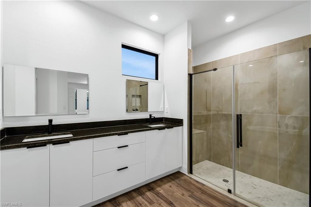 Bathroom, Dual Sink Vanities, Glass Shower, Interior, Recessed Lighting, Wood Texture Flooring