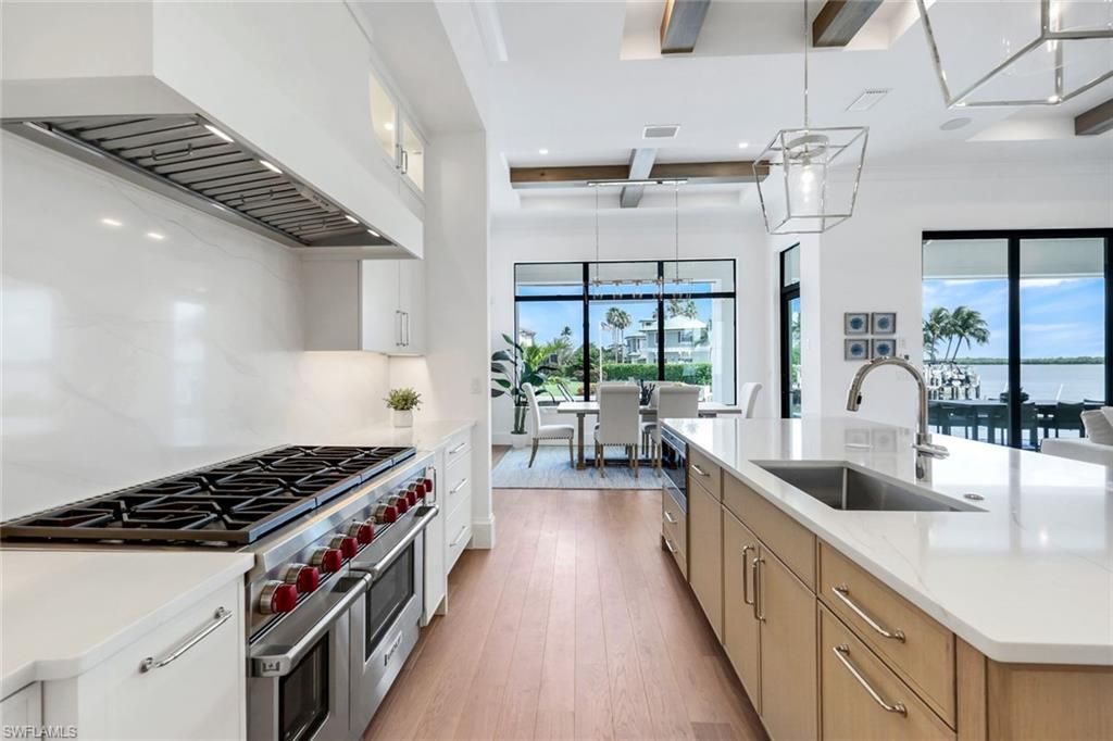 Dining room, Interior, Kitchen, Pendant Lights, Recessed Lighting, Stainless Steel Appliances, Water, Wooden Beams, Wood Texture Flooring