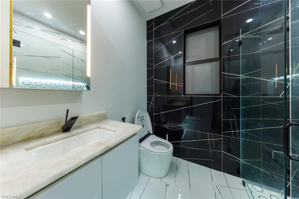 Bathroom, Dual Sink Vanities, Glass Shower, Interior, Marble, Recessed Lighting