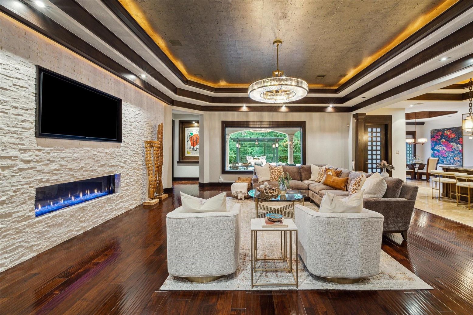 Chandelier, Dining room, Fireplace, Interior, Living room, Pendant Lights, Recessed Lighting, Stone Walls, Wood Texture Flooring