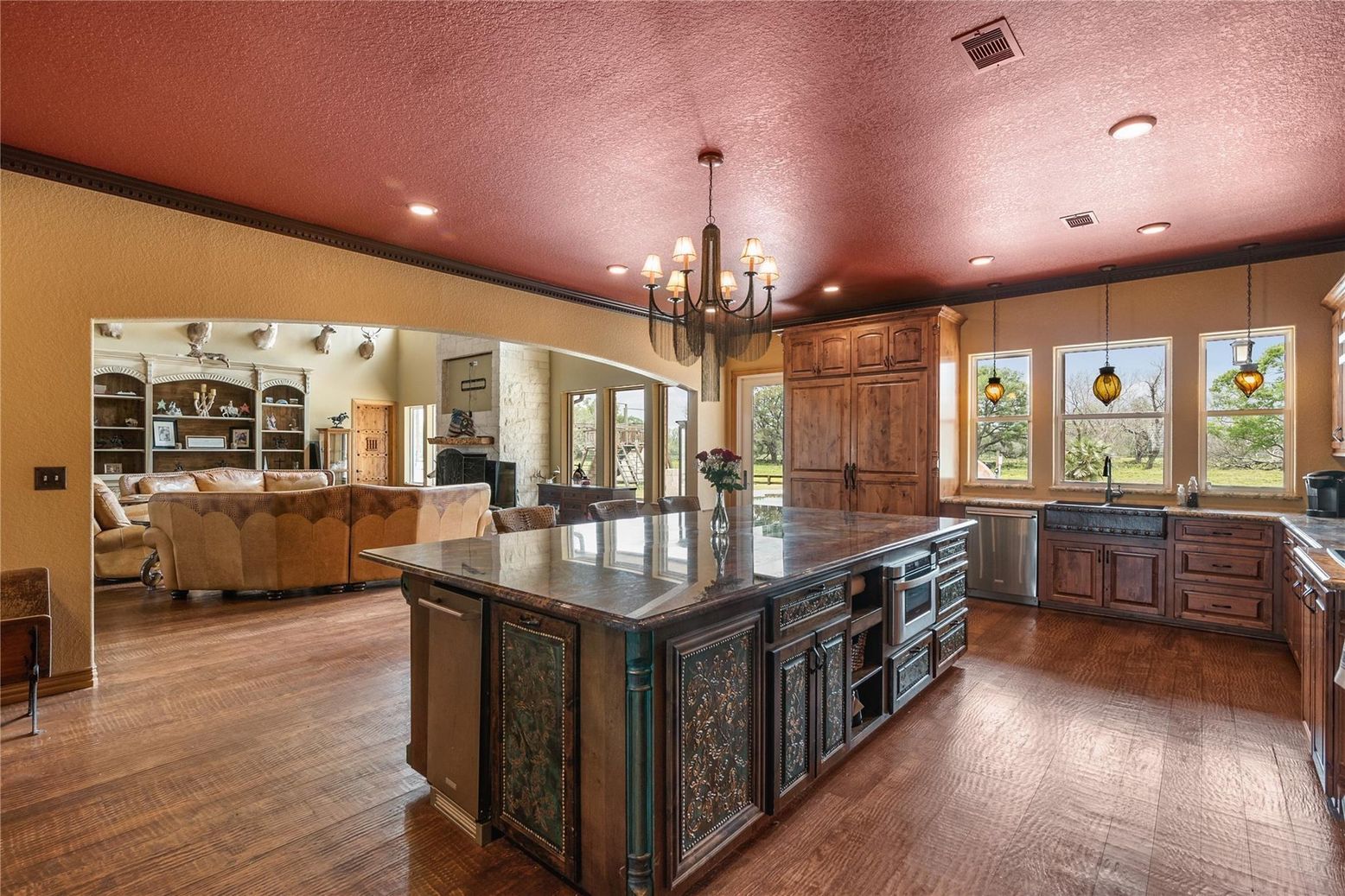 Chandelier, Fireplace, Interior, Kitchen, Living room, Pendant Lights, Recessed Lighting, Wood Texture Flooring