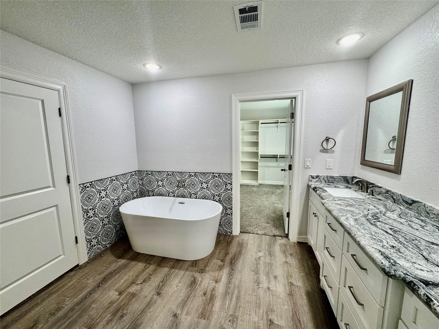 Bathroom, Dual Sink Vanities, Free Standing Baths, Interior, Recessed Lighting, Wood Texture Flooring