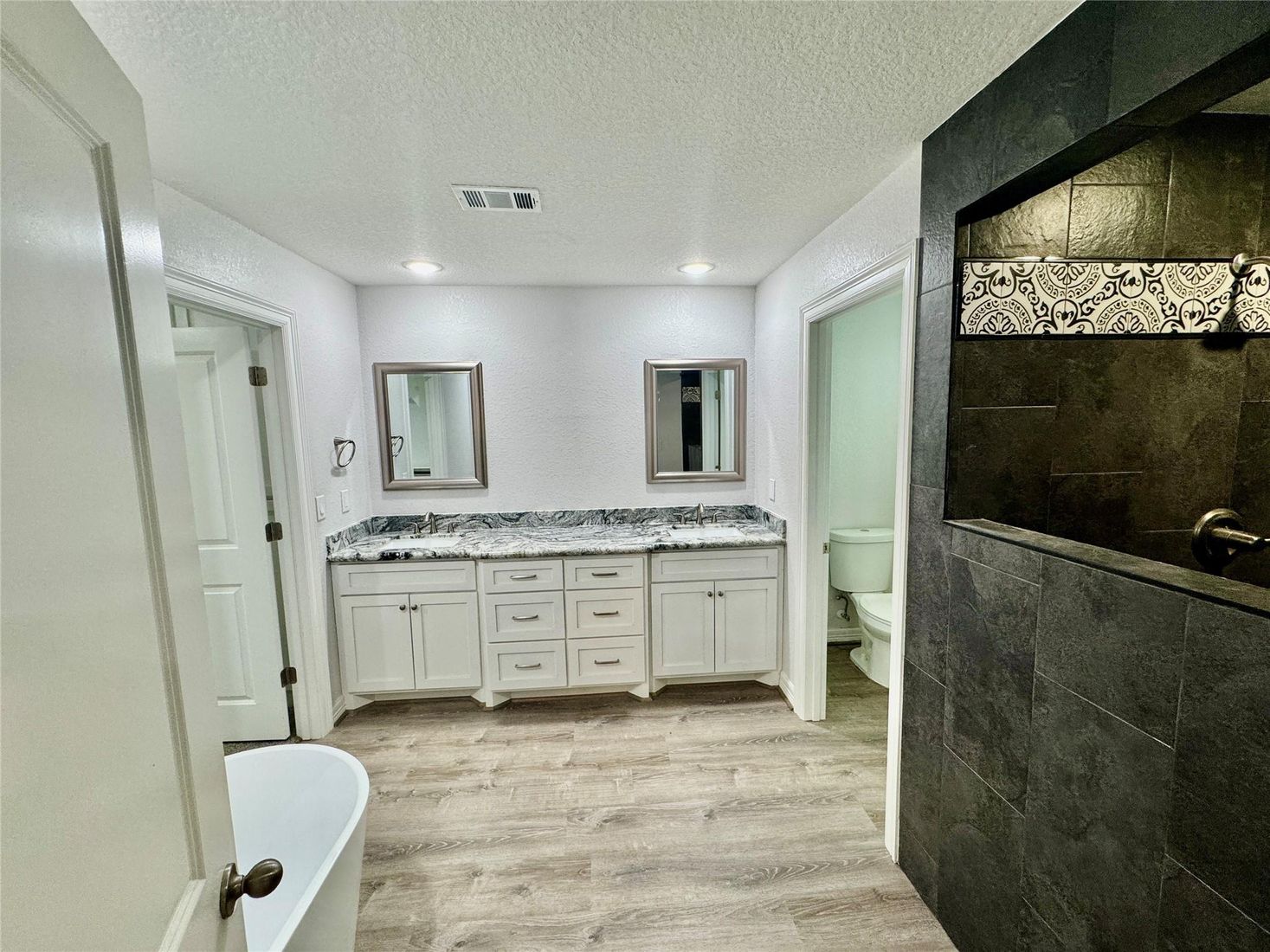 Bathroom, Dual Sink Vanities, Interior, Recessed Lighting, Wood Texture Flooring