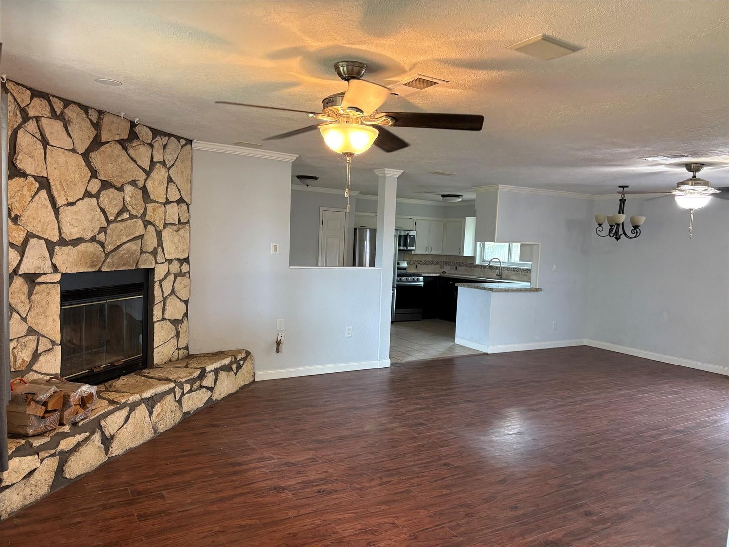 Chandelier, Empty room, Fireplace, Interior, Kitchen, Stone Walls, Wood Texture Flooring