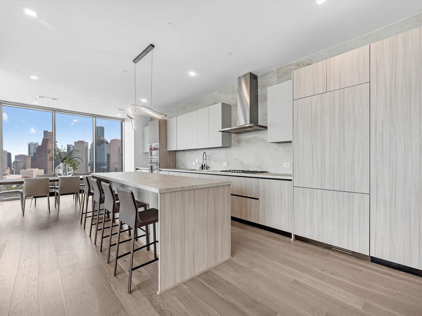 Dining room, Interior, Kitchen, Pendant Lights, Recessed Lighting, Stainless Steel Appliances, Wood Texture Flooring