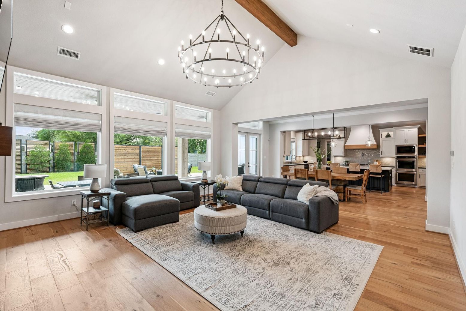 Chandelier, Dining room, Interior, Kitchen, Living room, Pendant Lights, Recessed Lighting, Stainless Steel Appliances, Wooden Beams, Wood Texture Flooring