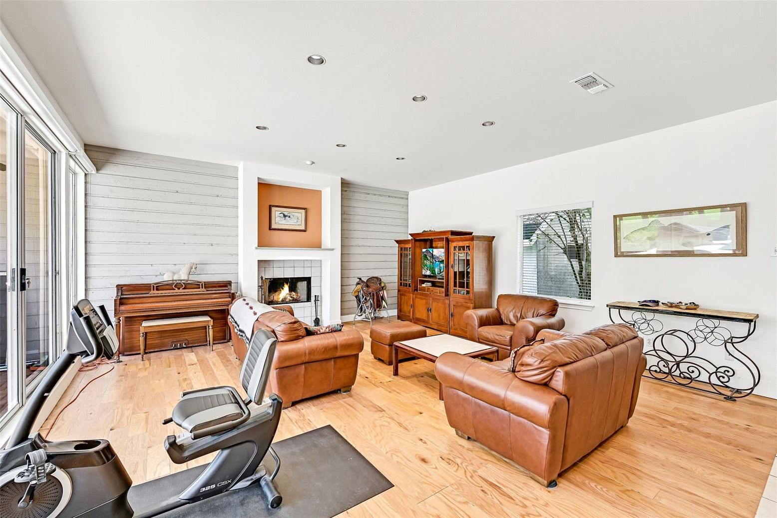 Fireplace, Fitness Equipment, Interior, Living room, Piano, Recessed Lighting, Wood Texture Flooring