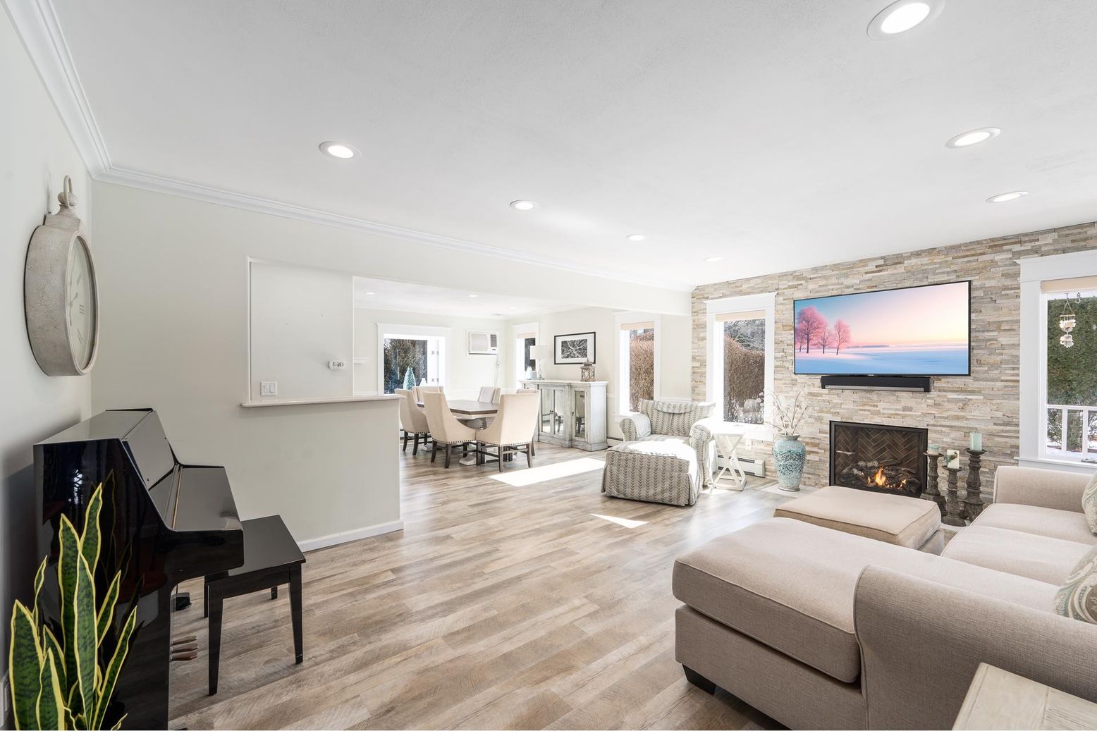 Dining room, Fireplace, Interior, Living room, Piano, Recessed Lighting, Stone Walls, Wood Texture Flooring
