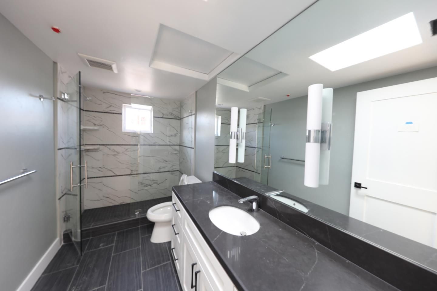 Bathroom, Dual Sink Vanities, Glass Shower, Interior, Marble, Marble Walls, Recessed Lighting