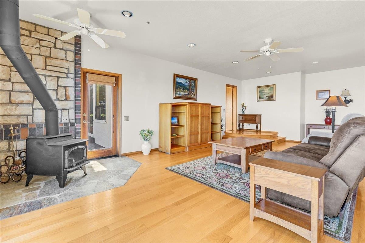 Fireplace, Interior, Living room, Recessed Lighting, Stone Walls, Wood Texture Flooring